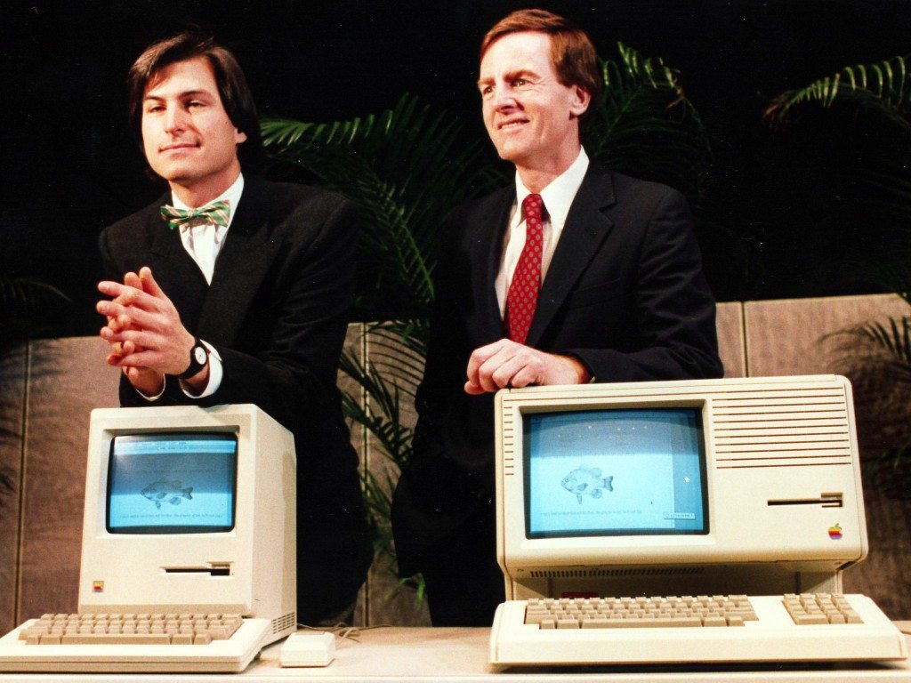 Apple's CEO Steve Jobs (left) and President John Sculley display the hardware unveiled at the annual shareholders meeting on Jan. 24, 1984.
